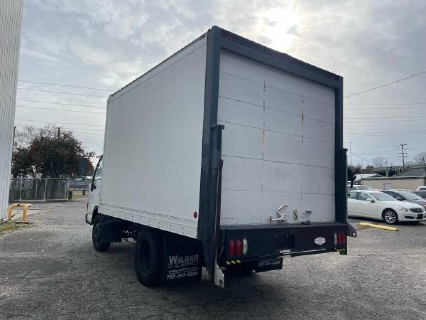 1999 white /gray Isuzu NPR (4KLC4B1R8XJ) with an 5.7 GAS V8 engine, Auto transmission, located at 5700 Curlew Drive, Norfolk, VA, 23502, (757) 455-6330, 36.841885, -76.209412 - -1999 Isuzu NPR 61k -Ready to work! -V8 gas motor -6 like new tires with great tread -12 ft box with roll up door -Tommy gate has been removed -No issues, runs and drives great -New state inspection -VADLR $250 processing fee. No other dealer fees. - Photo#4